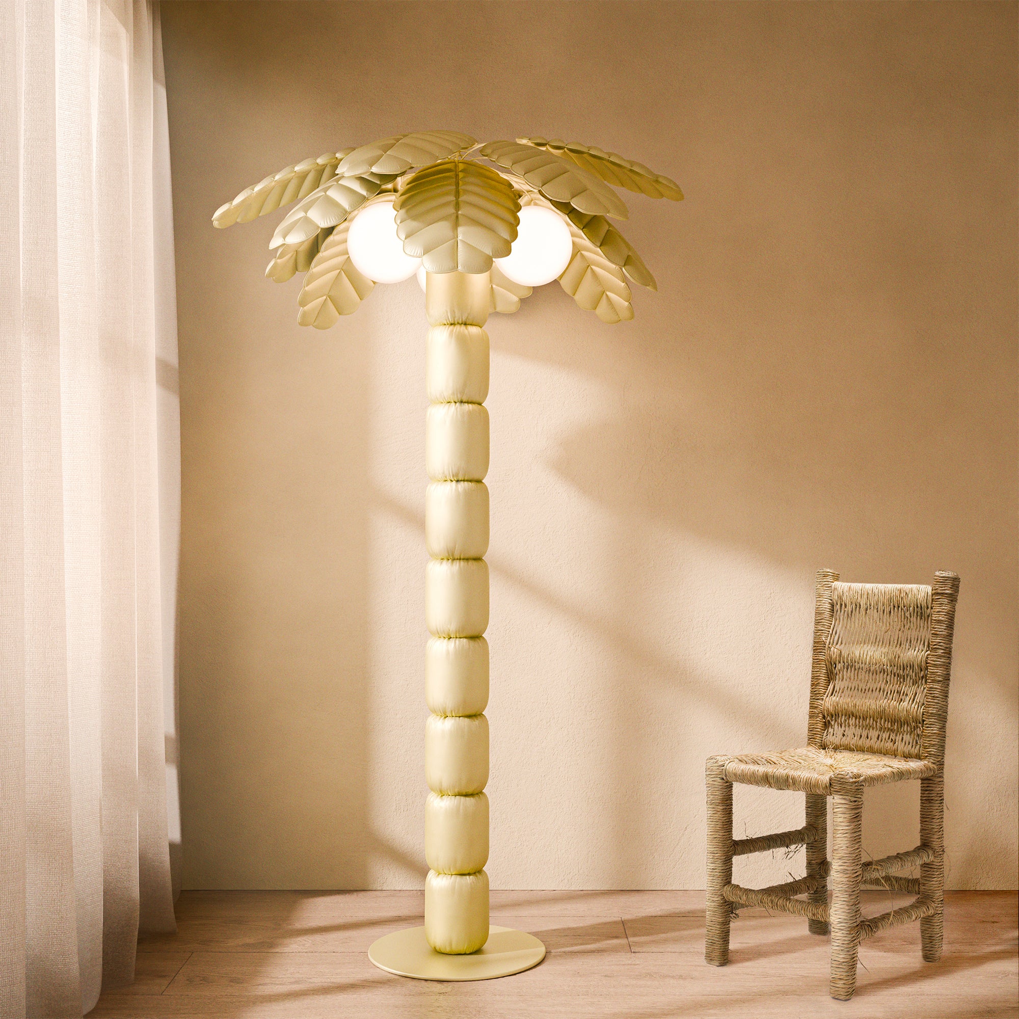 Palm Beach floor lamp illuminating a modern indoor, showcasing its palm-inspired design and ambient lighting.