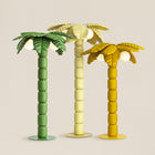 Palm Beach floor lamp illuminating a modern indoor, showcasing its palm-inspired design and ambient lighting.