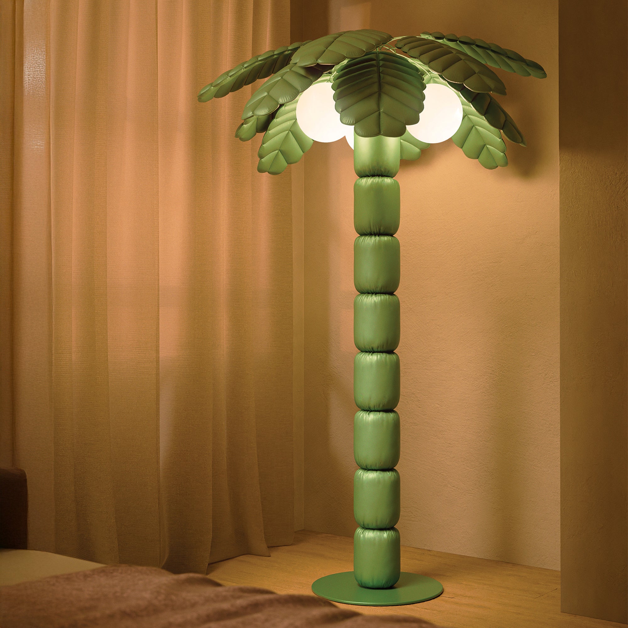 Palm Beach floor lamp illuminating a modern indoor, showcasing its palm-inspired design and ambient lighting.